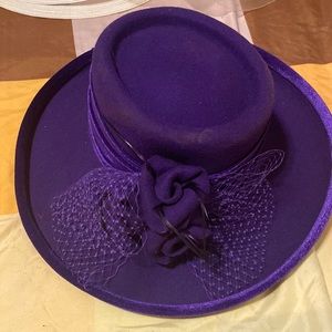 Purple hat with flowers in the front